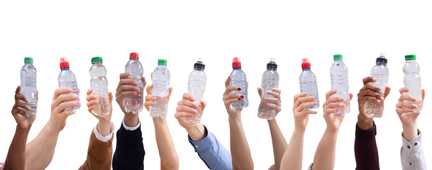 Different People Holding Water Bottles In A Row