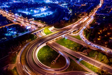 Fototapeta na wymiar Night Aerial view of a freeway intersection traffic trails in night Moscow