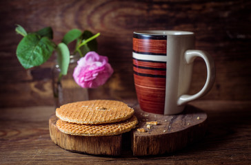 Still life with round waffers on wooden rustic background