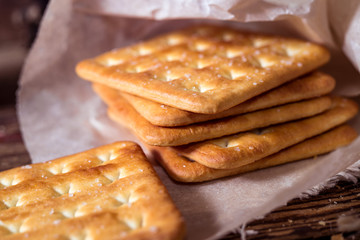 Salt cracker cookies on rustic wooden background