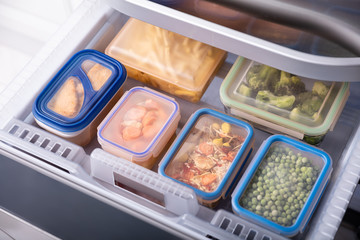 Containers With Various Food In Refrigerator