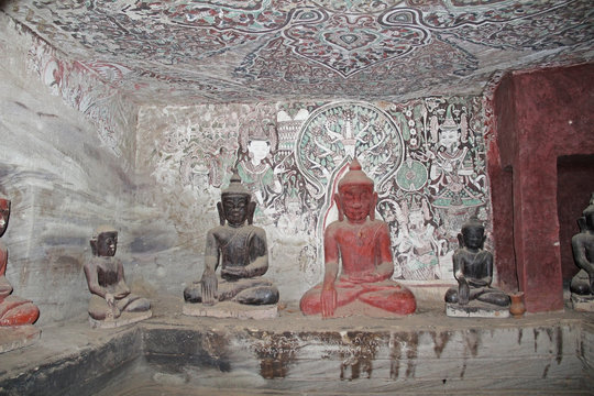 Painting on the walls and old Buddha statues in Pho Win Taung Caves, Monywa city, Sagaing State, Myanmar, Asia.