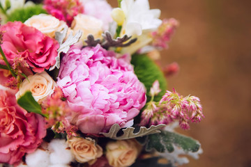 bouquet of flowers with roses, peonies, carnations. delicate bouquet in pink colors. eucalyptus leaves.