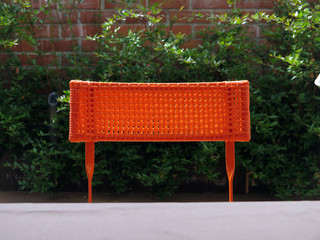 Backrest of orange plastic chair