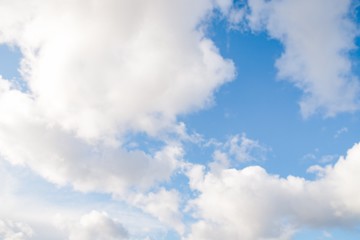 Beautiful white fluffy clouds on a blue sky background