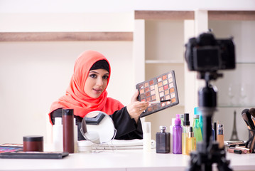 Beauty blogger in hijab recording video for her blog 