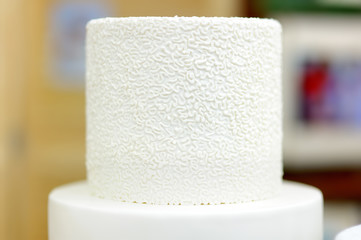 Traditional anniversary/wedding multi-layer cake decorated with flowers. And beautiful delicious sweet dessert.