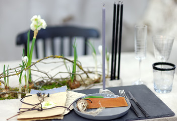 Table set for an event party or wedding reception in rustic or scandinavian style. Fashionable table set.
