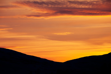 Fototapeta premium Silhouette hills during sunset in the mountains of Funäsfjällen, Sweden.