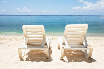 White Deck Chair In Front Of Sea At Beach