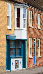 Obraz premium Terrace Housing and Colourful Tiled Butchers Shop Front