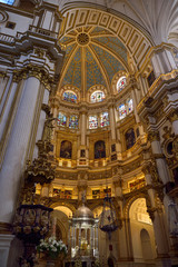 Fototapeta na wymiar Tabernacle and lectern in the Chancel rotunda with dome ceiling in the Granada Cathedral of the Incarnation