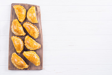Latin American baked beef empanadas with sauce