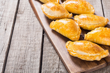 Latin American baked beef empanadas with sauce