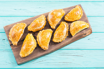 Latin American baked beef empanadas with sauce