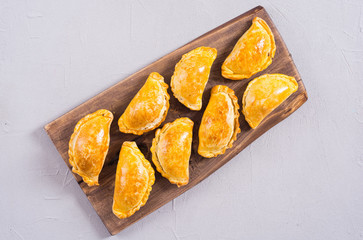 Latin American baked beef empanadas with sauce