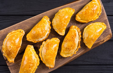 Latin American baked beef empanadas with sauce