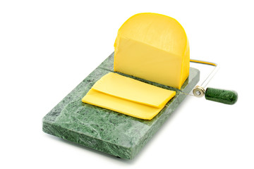 Wedge of gouda cheese with wire slicer