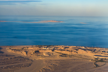 Aerial view on arabian desert and Red sea from the airplane