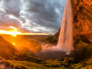 sunset hitting the waterfall iceland