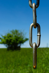 Chain with field in background