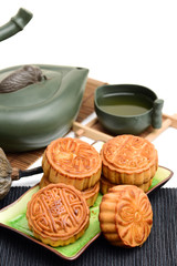 Obraz na płótnie Canvas Mooncake and tea,Chinese mid autumn festival food on white background