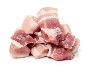Raw pork belly pieces on a white background