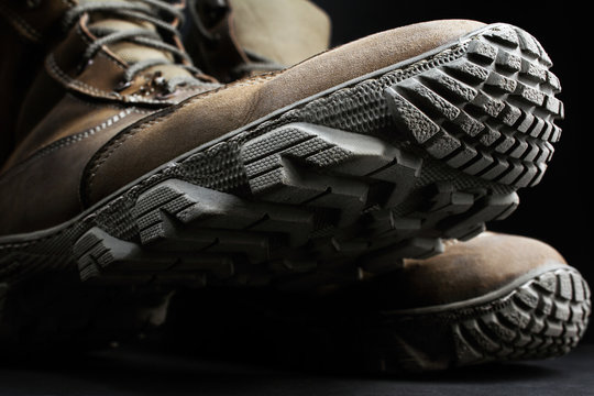 Closeup photo of military boots and protector.