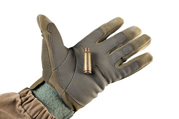 Soldier arm holding Ak 47 rifle bullet shell.