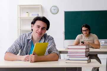 Two male students in the classroom 