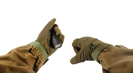 Soldier arms with military portable flashlight.