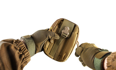 Soldier arms holding military tactical pouch.