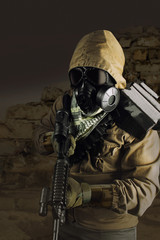 Desert post-apocalyptic soldier standing with rifle.