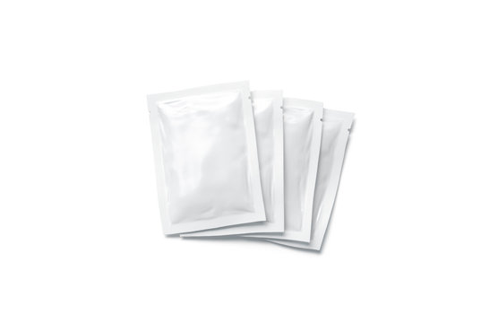 Blank white sachet packets stack mockup, isolated, top view, 3d rendering. Empty airtight pack mock-up for sauce, coffee, wet wipe, mayonnaise. Clear sealed bag with shampoo, cosmetic, gel, cream