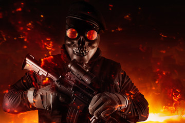 Soldier in skull mask, rifle, glasses and beret face front view.