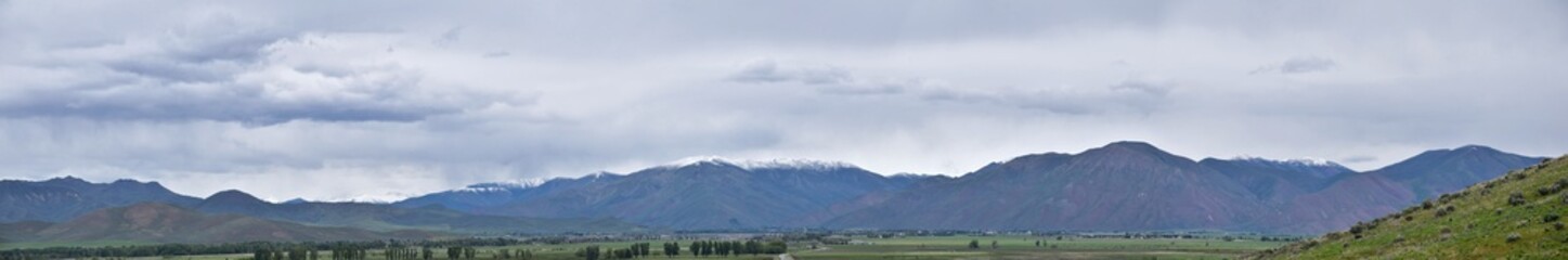 Obraz premium Sawtooth Mountains National Forest Landscape stormy panorama from South headed to Sun Valley, view of rural grazing land, Sagebrush, Lava Fields in Idaho. United States.