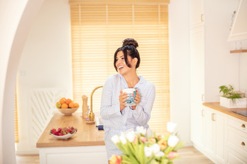 Obraz na płótnie Canvas Woman drinking coffee at home, relaxing.