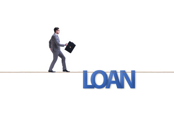 Debt and loan concept with businessman walking on tight rope