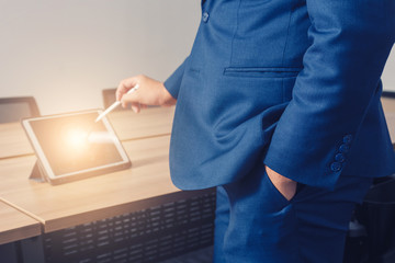 businessman working with tablet in seminar room