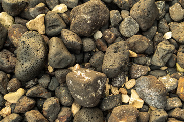 Naturally occurring lava and sedimentary lithified stones mixed together to form interesting patterns