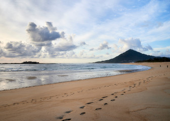 Beach of moledo at the end of the day, with a view to trega mountain on spanish side of the border. Low tide displaying the sandy beach on a cloudy day.