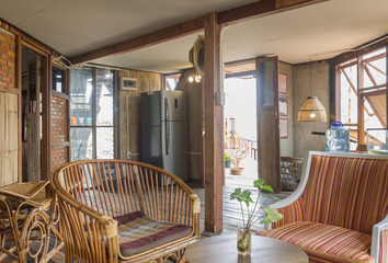 Rattan Chair and Arm Chair and Refrigerator in Country Loft Interior Design Room