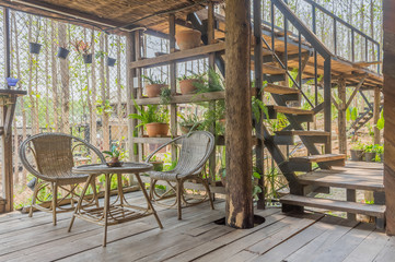 Interior Design Room of Home Stay with Rattan Chair and Table and Stair