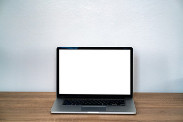 Fototapeta premium Laptop blank screen on wooden table.