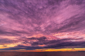 Fototapeta premium Colorful sunset sky. Fiery powerful sunset. Moody colorful sunset. Sunset over a lake.