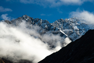 Gorgeous white snow covered peak of Aoraki Mount Cook in New Zealand with blue sky landscape background.