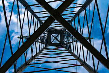 Fototapeta na wymiar abstraction from aluminum power line design on a blue background