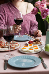 A gourmet lunch for two: a plate of dried cranberries and walnuts, a small bowl of honey