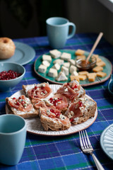 A nutritious and tasty breakfast for two: baked apples, baguette slices with smoky salmon 