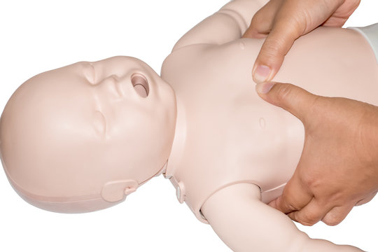Education healthcare first aid of CPR training medical procedure of a newborn, demonstrating chest compression on CPR doll ,emergency training for safe life use automated external defibrillator(AED).